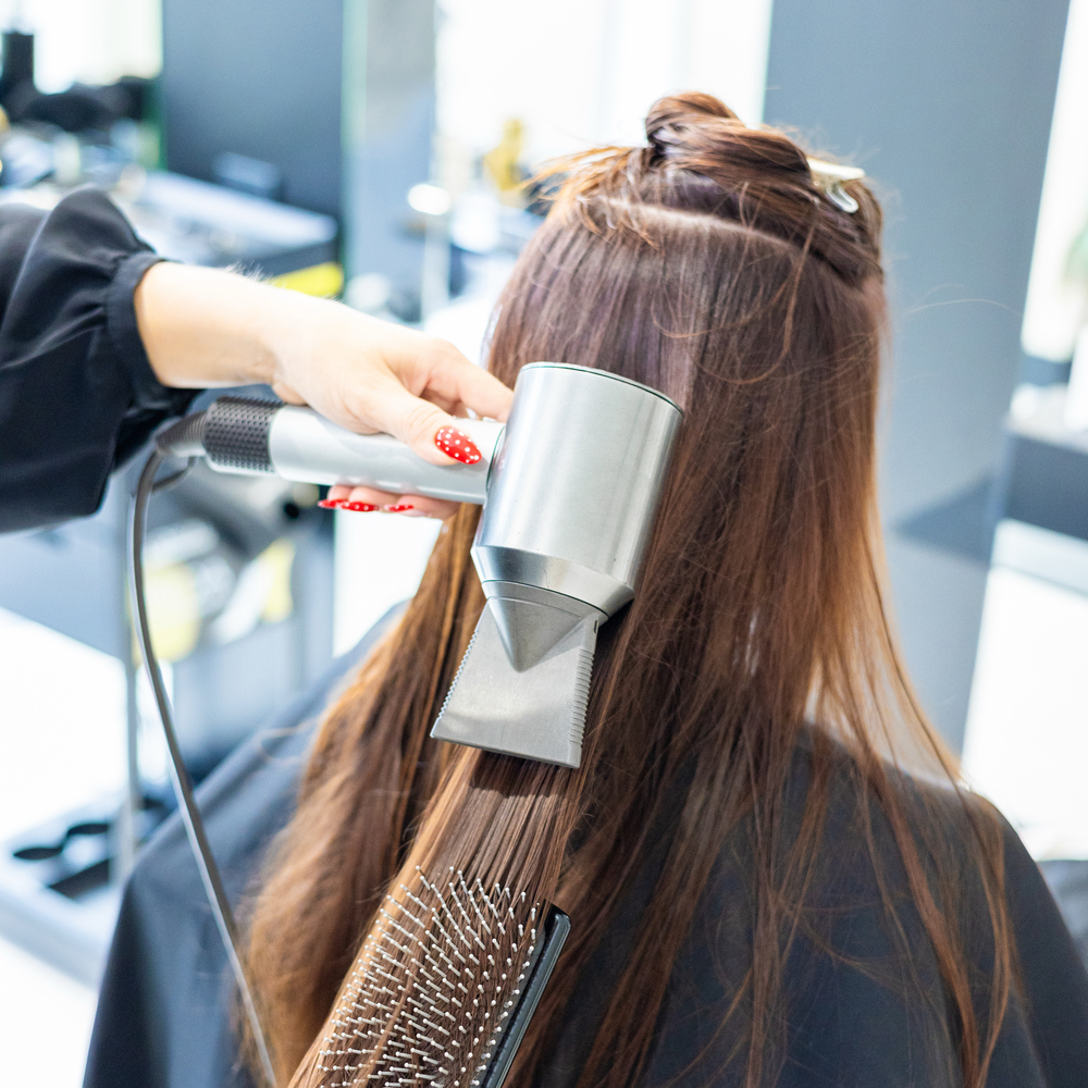 Professional hair blowout service at Salon Afton in Concord, NC